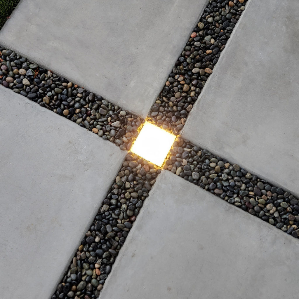 Lumengy Paver Light Amidst Pebbles and Gravel