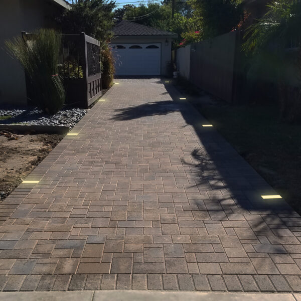 Lumengy 3x6 Paver Lights lining a walkway