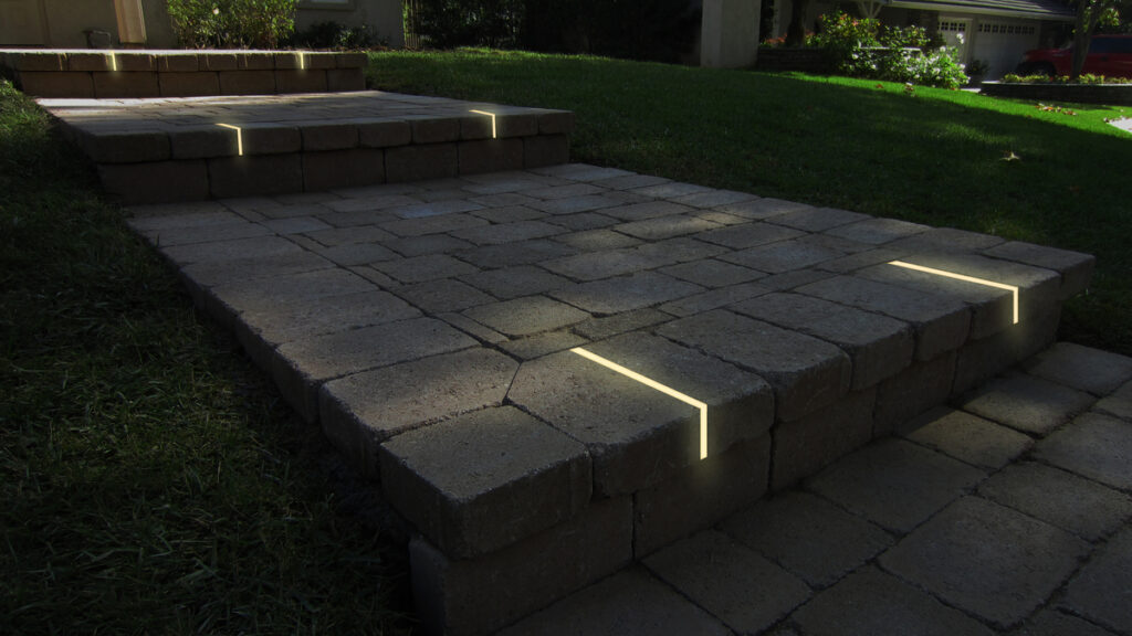 Lumengy's hidden paver lights create a dazzling glow in brick walkway, lasting years to illuminate your path.