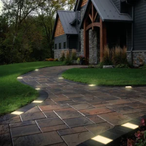 Drive-over paver lights for driveways installed along a paved home entrance pathway